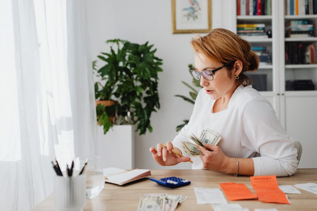 image of a women completing money tasks